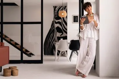 Full shot rich woman at home