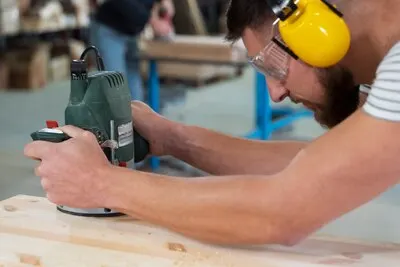 Man working on cutting mdf board