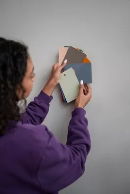 Interior designer with color palette for wall paint
