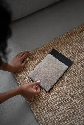 Interior designer with carpet sample