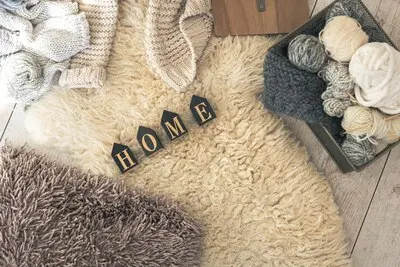 Cozy home composition with threads for knitting top view