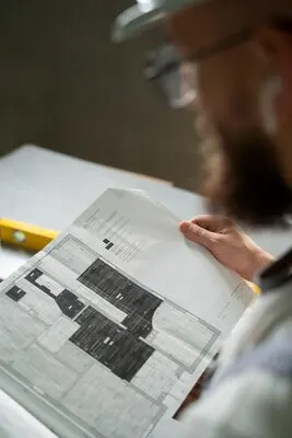 Tiler working on renovation of apartment