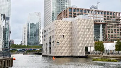 Street scape of the Canary Wharf district water channels with modern buildings and skyscrapers