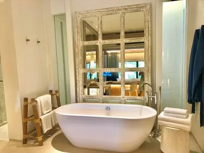 Bathroom interior background and white spa towels on wood
