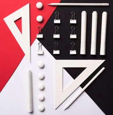Office supplies on white red and black table