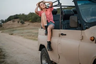Woman enjoying her time while traveling by car