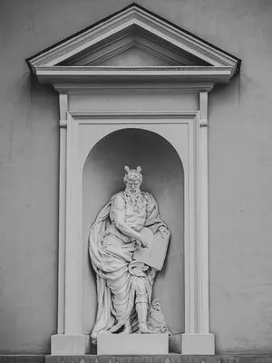 Beautiful shot of a white niche sculpture of an old man