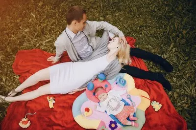 Man looking at his wife while sleeping