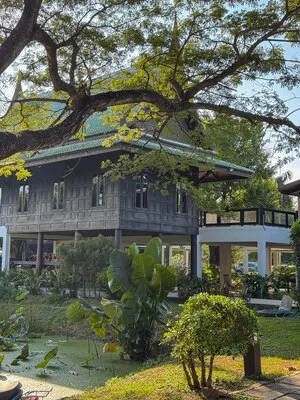 Bangkok Elephant Care Sanctuary buildings with a lake and lotus flowers
