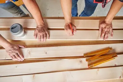 Collaboration of two carpenters in building