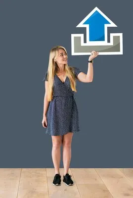 Woman holding an upload icon in a studio
