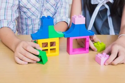 Kids playing pieces plastic creative construction blocks