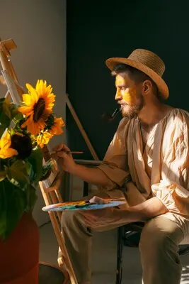 Full shot man  painting on canvas