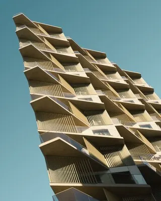 Vertical low angle view of a beige metal building under the blue sky