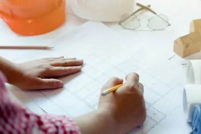 Architect or engineer working in office