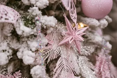 Different object toy gifts hanging on a decorated christmas tree