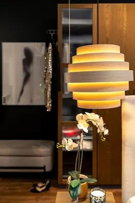 Warm pendant lamp in a cozy bedroom soft glow