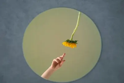 Mirror background with hands outdoors