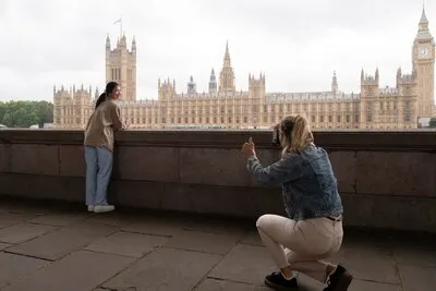 Side view woman taking photos of friend