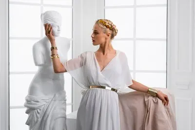 Front view model posing as greek goddess