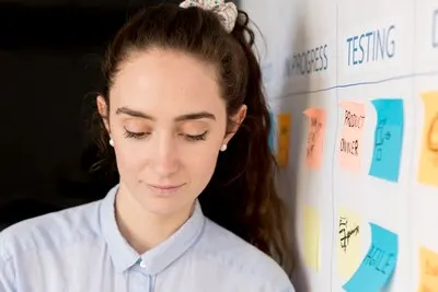 Portrait of woman working on scrum method
