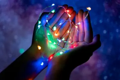View of hands tiny lights