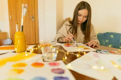 Artist sitting at the desk and works