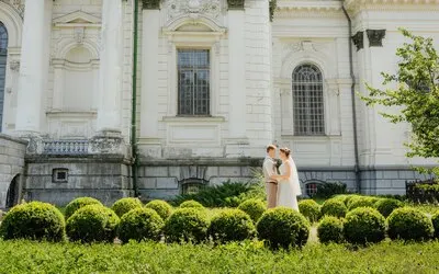 Wedding couple. Beautiful couple, bride and groom against a white castle
