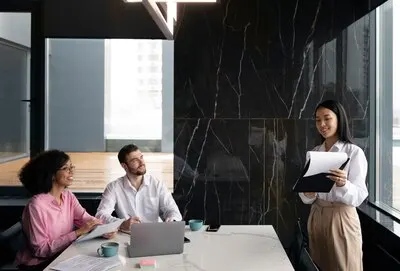 Woman showing her colleagues documents