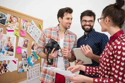 Professional photographers working at their office