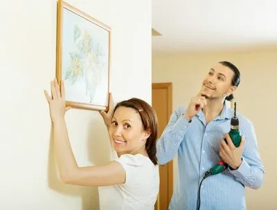 Happy middle-aged couple choosing place for picture