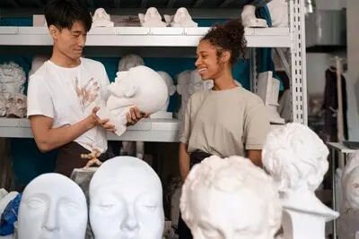 Front view smiley people with clay sculptures