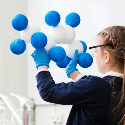 Close-up girl studying chemistry