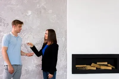 Woman giving a set of key to a man