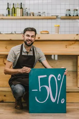 Cheerful bartender with discount announcement