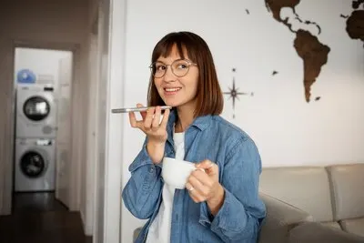 Young woman using home technology