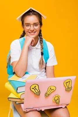 Portrait of schoolgirl on yellow background