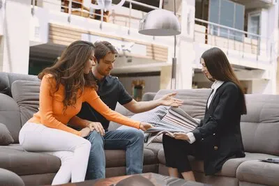 Couple choosing fabric in furniture store