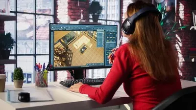 Female employee creates 3D render of an apartment interior using blueprints