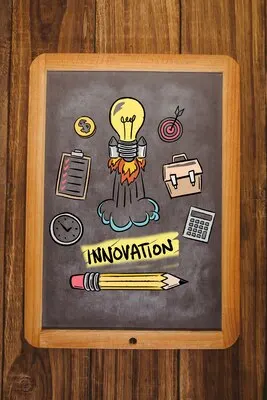 Bulb with rocket in a blackboard