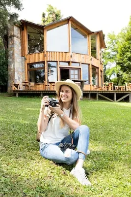 Woman smiling and filming with her camera