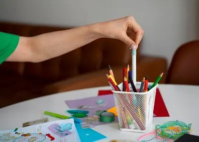 Side view woman doing creative journaling