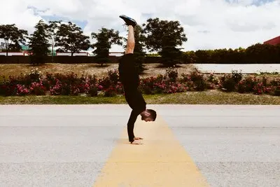 Young man exercising handstand