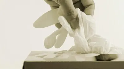 Woman taking disposable gloves from the box