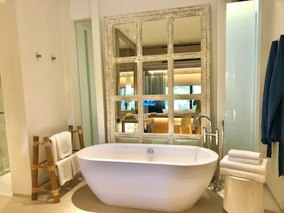 Bathroom interior background and white spa towels on wood