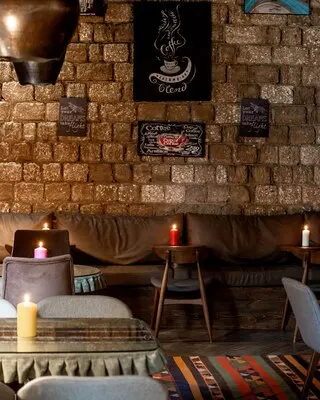 Restaurant with leather sofa paintings on the wall