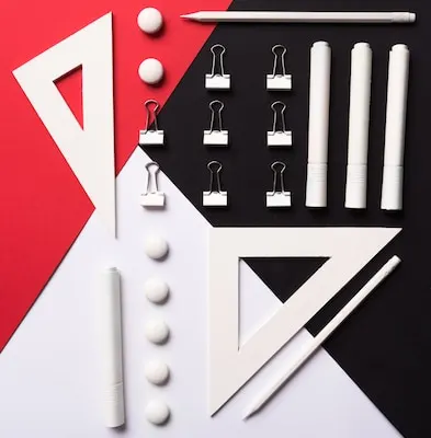Office supplies on white red and black table