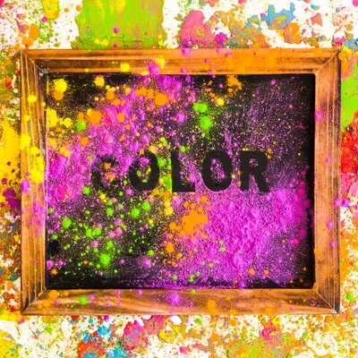 Frame with color inscription on bright dry colours