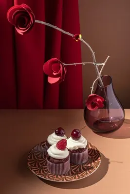 High angle cupcakes and paper roses