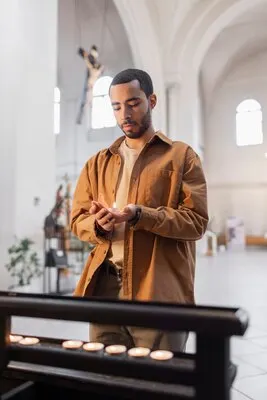 People visiting and praying in church building